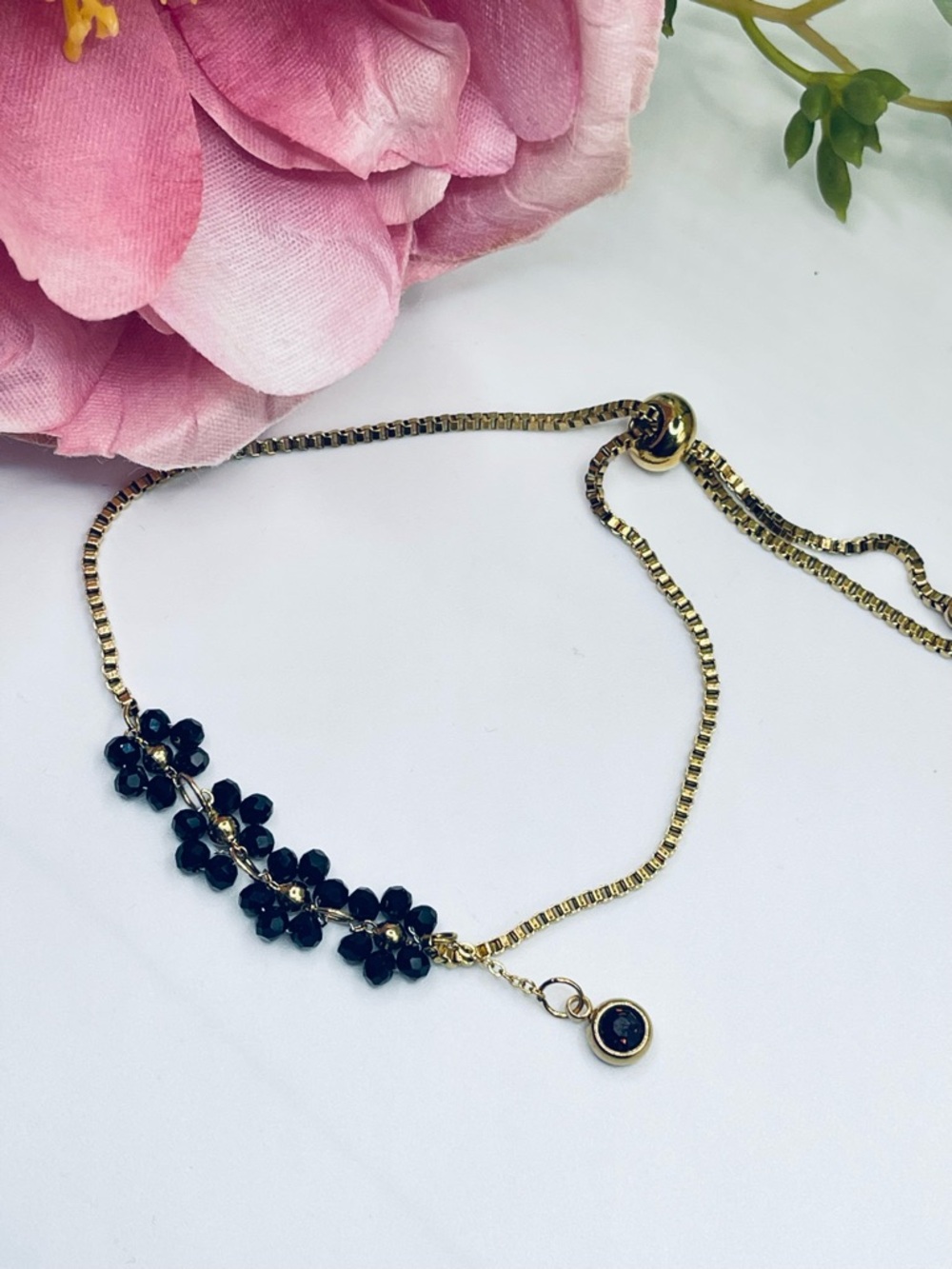 Black spinel, gold stainless steel bracelet